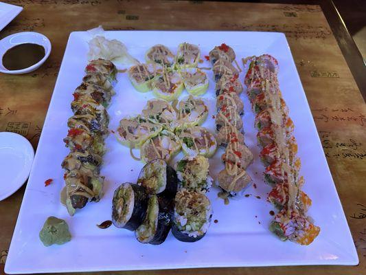 Clockwise from left: Dragon roll, Love roll, Special Spicy Tuna roll, Big Christmas roll, and  Spider Roll