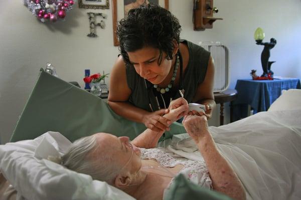 Amy Long, GNP attentively listens to her patient Flo.