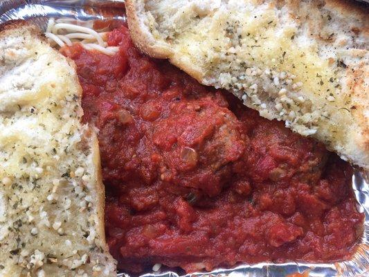 Spaghetti and meatballs with 2 huge pieces of garlic bread. Very good!