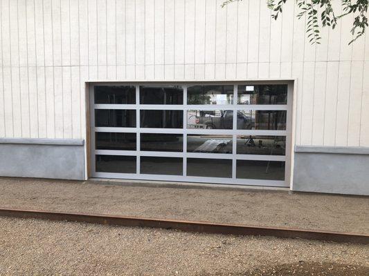 Full vision garage door. Clear anodized Rails with insulated clear glass  14×7 vertical lift. Installed in Scottsdale Arizona