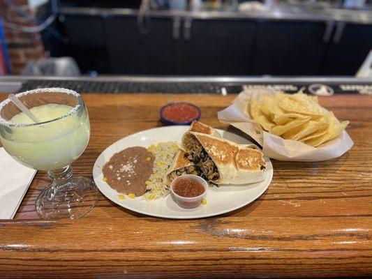 Big Burrito served with lime rice and refried beans.