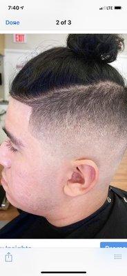 Nice and fresh skin fade with a man bun...