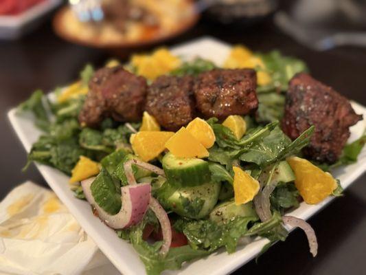 Arugula, filet mignon salad, out standing with those orange slices! Meat so tender!