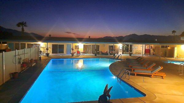 A view of the pool area and setting Sun.