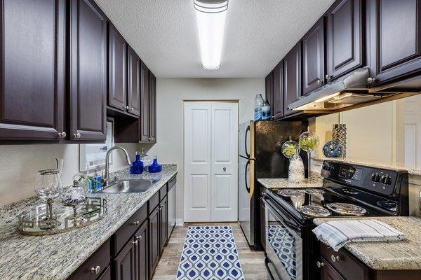 Granite Countertops and energy efficient stainless steel appliances in every home!