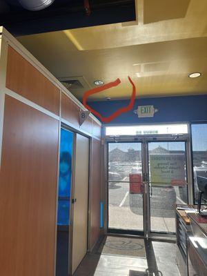 Picture taken from the front counter looking toward the front door either the tanning room to the left.