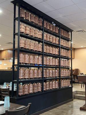 The beautiful wall of copper Buddhist prayer wheels.