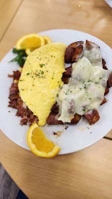 Bacon and cheese omelet with American cheese on potatoes