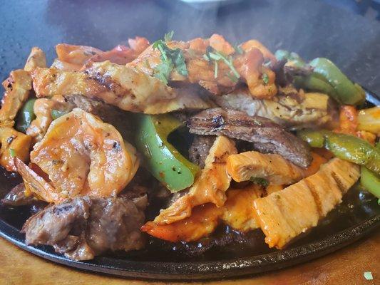 Chicken, steak and shrimp fajita