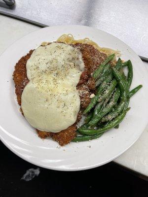 Classic Chicken Parm served over linguini and veg du jour.