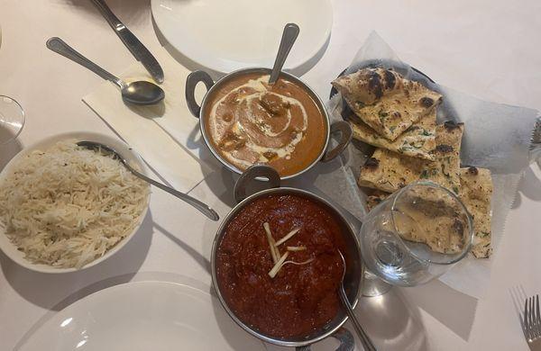 Chicken Tikka Masala (top), Garlic Naan, Lamb Vindaloo, and a slide of Basmati Rice