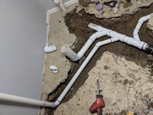 Rough plumbing for a bathroom in a basement