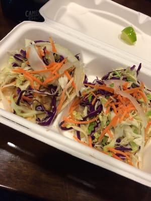 Chicken tacos. The chicken is there somewhere underneath that slaw