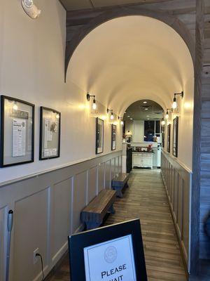 This is a photo of the charming arched hallway that leads to the dining area.