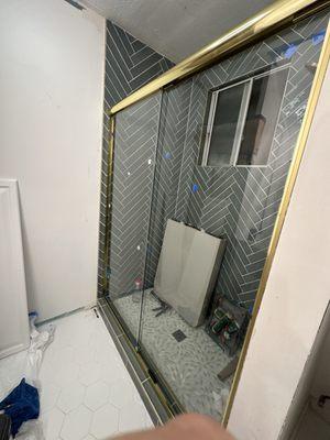 custom shower doors with Gold frame. very easy install. did myself.