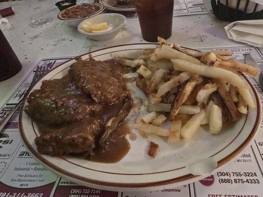 Baked steak with fried potatoes