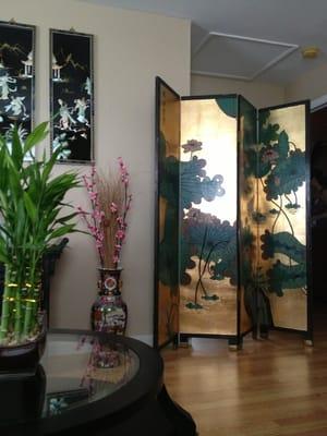 Here is a beautiful  antique Asian screen in the lounge.