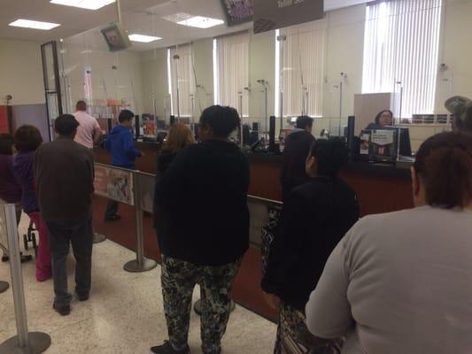 2 tellers, 13 people in line