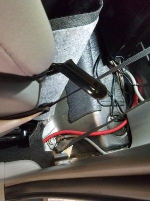 Put the grounding wire to the seat bolt in the car! This is not a good location for the ground wire! Fried my amp.