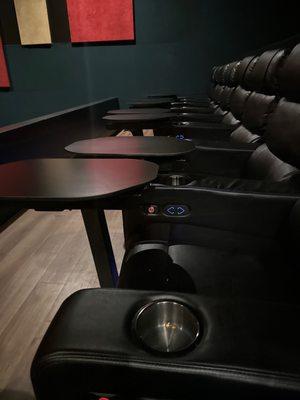 Reclining seats with table and cup holders