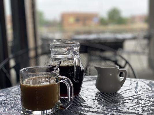 Delicious coffee on the patio by the river