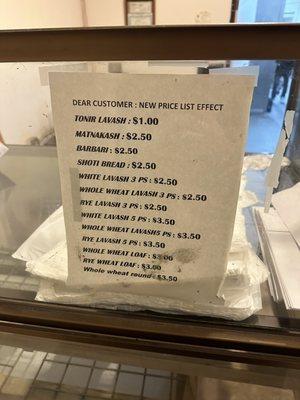 New price list (menu) posted on the 316 E Maple Street counter