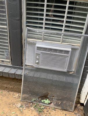 Window unit installed by maintenance with controls on the exterior and demolished screen