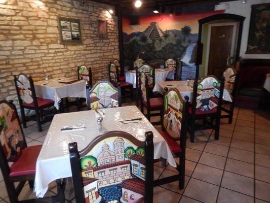 This is the first dining area through the doorway to your right. It also has booths, and tables by the windows.