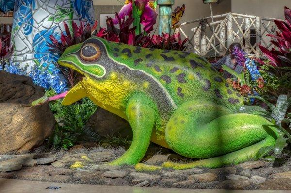 This whimsical spring display features a giant mechanical frog, bringing the season to life with its playful antics and moving tongue!