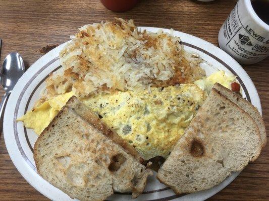 Philly steal & cheese omelette with shredded hash browns and sourdough toast.