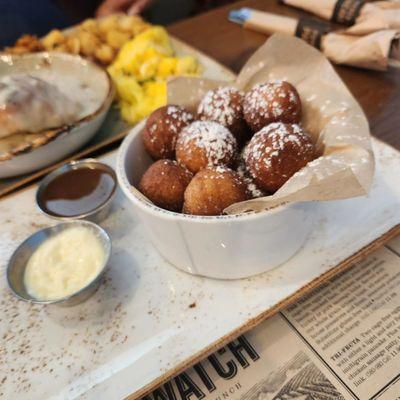 GINGERBREAD SPICE DONUTS Warm cake donut holes tossed with gingerbread spice and lightly dusted with powdered cinnamon sugar.