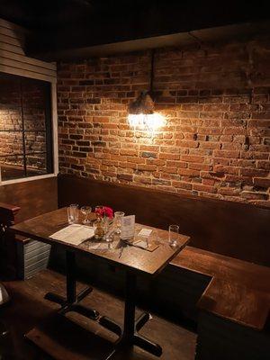 Dark, rustic speakeasy feel.