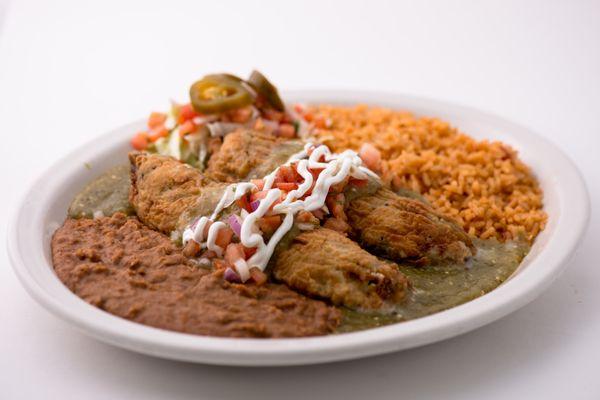 The Chile Rellenos come are fire-roasted and filled with your choice of meat. Battered and fried to perfection and drizzled with sour cream