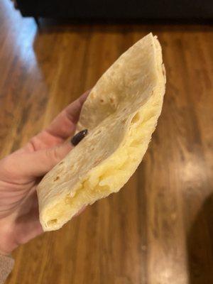 Hardly melted and very plain bland quesadilla