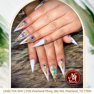 Make a bold statement with our long stiletto nails adorned with sparkling rhinestones!