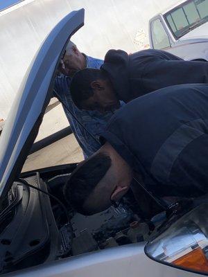 Mike Bell of Bell Tuning looking over a 2005 Honda Odessy with a blown coil.