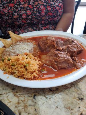 Birria with rice and beans , traditional.