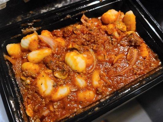 Gnocchi with bolognese sauce ($2.00 extra), mushrooms,  onions,  and  cherry tomatoes. The gnocchi was soft and fluffy.