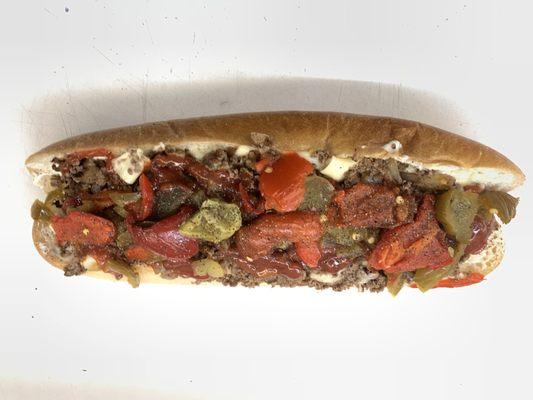 Cheesesteak with hot peppers, sweet peppers, mayo and ketchup.