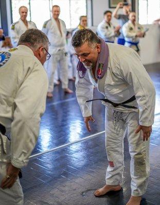 Head instructor Joe receiving his brown belt after an in-house tournament for our kids martial arts program