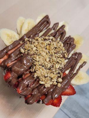 1/2 Green 1/2 Acai base smoothie bowl with Nutella, granola, banana, strawberry