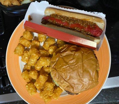 Double burger, hot dog, and tater tots