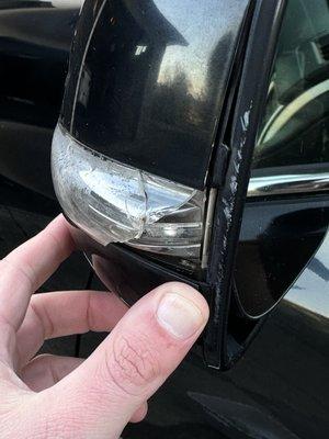 Broken Mirror blinker with moisture, scratches on mirror frame clearly due to impact