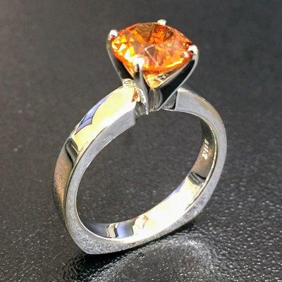 7.6mm Round Brilliant Cut Mandarin Orange Spessartite Garnet Rung set into a 14k white gold solitaire with Europe