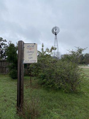 Look for the little sign off to your left when you drive toward the library. There's a small parking lot for the quilt shop.