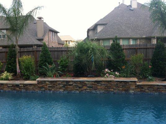 Adding a beautiful landscape behind your new pool is the finishing touch to your backyard make over.