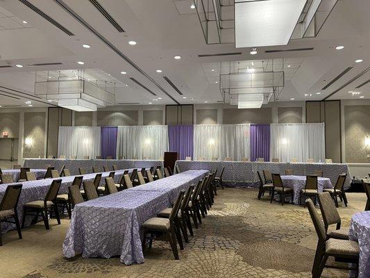 A room that was beautifully set up for a luncheon.