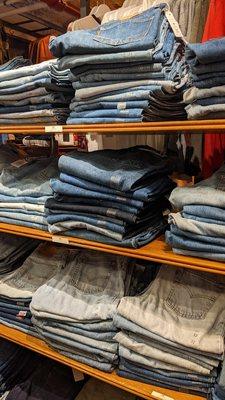 Stacks of vintage Levi's, loosely organized by cut and size