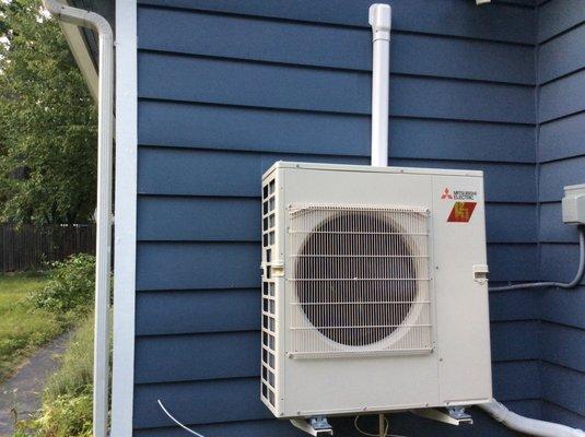 Neatly placed on side of the house, the Mitsubishi condenser is sleek, quiet yet powerful.