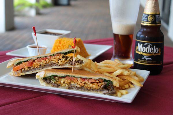 Steak Sandwich, Fries, Beans & Rice and a Ice Cold beer